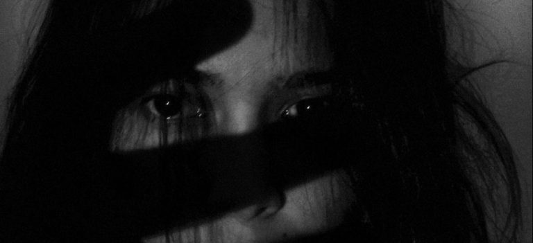 Photo by Joanne Adela Low from Pexels of young woman covering her face with her hands